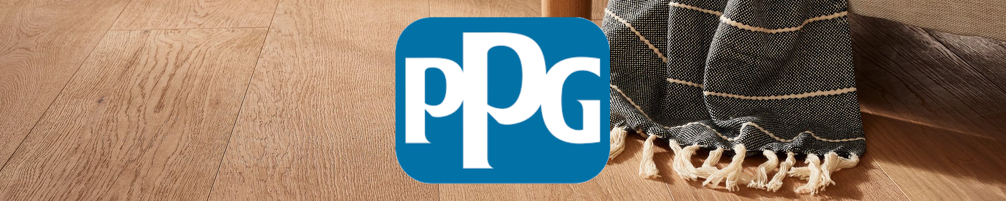 PPG Paint Logo Banner on Hardwood Background